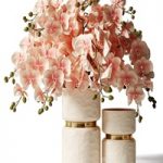 Bouquet of pink orchids in a modern beige vase