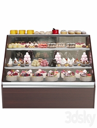 Confectionery. Refrigerator with sweets and desserts. Cake
