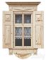 Wooden window with shutters and architraves