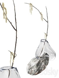 Branch with earrings in a sculpture vase by Laetitia Jacquetton